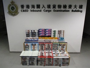 A 32-year-old man was convicted at the West Kowloon Magistrates’ Courts on August 6 for importing duty-not-paid cigarettes and making use of an altered structure of a vehicle for the purpose of smuggling articles, in contravention of the Dutiable Commodities Ordinance and the Import and Export Ordinance. He was sentenced to four months' imprisonment for each of the charges that will run concurrently. Photo shows the duty-not-paid cigarettes involved in the case.