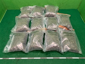 Hong Kong Customs today detected a drug trafficking case involving baggage concealment at Hong Kong International Airport and seized about 11 kilograms of suspected cannabis buds with an estimated market value of about $2.6 million, as well as 91 sticks of illicit cigarettes. Photo shows the suspected cannabis buds seized.