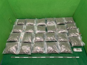 Hong Kong Customs detected two drug trafficking cases involving incoming passengers at Hong Kong International Airport yesterday (August 26) and seized about 24.5 kilograms of suspected cannabis buds with a total estimated market value of about $5.6 million. Photo shows the suspected cannabis buds seized in the first case.