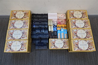 Hong Kong Customs mounted a special operation between August 27 and September 16 to combat the sale of counterfeit mooncakes and other goods. About 170 boxes of suspected counterfeit mooncakes and more than 3 700 items of suspected counterfeit goods, including apparel, accessories, proprietary Chinese medicines, perfumes, cosmetics and skincare products, with an estimated market value of about $1 million were seized. Photo shows the suspected counterfeit goods seized.
