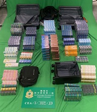 A 43-year-old incoming male passenger was sentenced to eight months' imprisonment and fined $1,000 by the West Kowloon Magistrates' Courts today (September 22) for importing duty-not-paid cigarettes and failing to declare them to Customs officers, as well as for importing alternative smoking products, in contravention of the Dutiable Commodities Ordinance and the Import and Export Ordinance. Photo shows the duty-not-paid cigarettes and the alternative smoking products seized.
