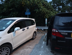 Hong Kong Customs and the Fire Services Department mounted a territory-wide special operation targeting illicit fuel activities over the past two weeks. Photo shows Customs officers cracking down on a mobile illicit fueling station in a public car park in Tai Wai on September 17.