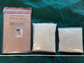 Hong Kong Customs yesterday (October 4) detected a drug trafficking case at the Hong Kong-Zhuhai-Macao Bridge Hong Kong Port and seized about 850 grams of suspected etomidate powder and one suspected etomidate capsule with an estimated market value of about $2.4 million. Photo shows the suspected etomidate powder and the suspected etomidate capsule seized.