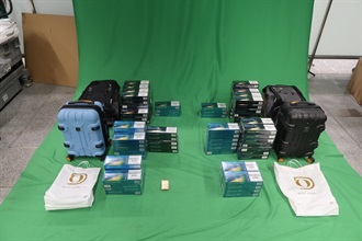 Two incoming passengers were both sentenced to three months' imprisonment and fined $2,000 by the West Kowloon Magistrates' Courts today (October 15) for possessing duty-not-paid cigarettes and failing to declare them to Customs officers, in contravention of the Dutiable Commodities Ordinance. Photo shows the duty-not-paid cigarettes seized.