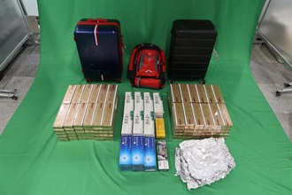 A 37-year-old incoming male passenger was sentenced to two months' imprisonment and fined by the West Kowloon Magistrates' Courts today (November 7) for importing duty-not-paid cigarettes and failing to declare them to Customs officers, in contravention of the Dutiable Commodities Ordinance. Photo shows the duty-not-paid cigarettes seized.