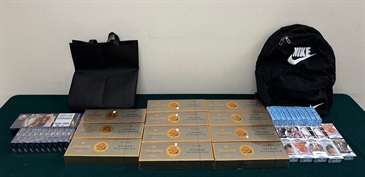 A 45-year-old incoming female passenger was sentenced to four weeks and six days' imprisonment by the Fanling Magistrates' Courts today (November 10) for possessing duty-not-paid cigarettes and failing to declare them to Customs officers, in contravention of the Dutiable Commodities Ordinance. Photo shows the duty-not-paid cigarettes seized and the baggage used to conceal the duty-not-paid cigarettes.