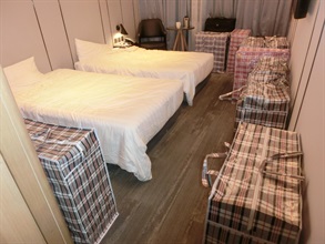 Hong Kong Customs yesterday (November 12) raided a suspected illicit cigarette storage centre in Kwai Chung and seized about 240 000 suspected illicit cigarettes with an estimated market value of about $1.08 million and a duty potential of about $790,000. Five persons suspected to be connected with the case were arrested. Photo shows some of the suspected illicit cigarettes seized in a hotel room involved in the case.