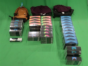 An 40-year-old incoming female passenger was sentenced to three months' imprisonment and fined $1,000 by the West Kowloon Magistrates' Courts today (November 15) for importing duty-not-paid cigarettes and failing to declare them to Customs officers, in contravention of the Dutiable Commodities Ordinance. Photo shows the duty-not-paid cigarettes seized.