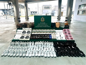 Hong Kong Customs on November 2 and 4 seized about 3 300 suspected counterfeit goods, including mobile phones, footwear, bags and accessories, with an estimated market value of about $2.5 million at the Hong Kong-Zhuhai-Macao Bridge Hong Kong Port. Photo shows the suspected counterfeit goods seized.