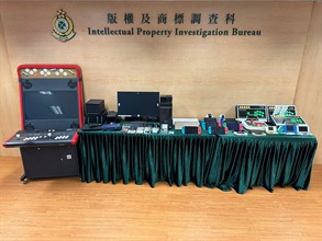 Hong Kong Customs conducted an enforcement operation on November 24 to combat infringing activities involving circumventing game consoles. Eight game consoles suspected to be connected with the case, 13 sets of suspected infringing game consoles, 29 memory cards containing suspected infringing games, a desktop computer with an external hard disk used for dealing with infringing games and a batch of computer equipment were seized. The total estimated market value was about $150,000. Photo shows the seized items.