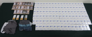 A 51-year-old incoming male passenger was sentenced to two months' imprisonment and fined $1,500 by the Fanling Magistrates' Courts today (November 28) for possessing duty-not-paid cigarettes and failing to declare them to Customs officers, in contravention of the Dutiable Commodities Ordinance. Photo shows the duty-not-paid cigarettes seized and the clothing used to conceal the duty-not-paid cigarettes.