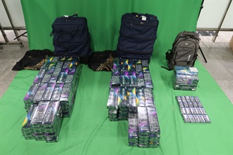 A 48-year-old incoming female passenger was sentenced to six months' imprisonment and fined $1,000 by the West Kowloon Magistrates' Courts today (December 2) for dealing with duty-not-paid cigarettes and failing to declare them to Customs officers, in contravention of the Dutiable Commodities Ordinance. Photo shows the duty-not-paid cigarettes seized.