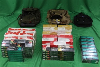 A 36-year-old incoming male passenger was sentenced to three months' imprisonment and fined $500 by the West Kowloon Magistrates' Courts today (December 3) for importing duty-not-paid cigarettes and failing to declare them to Customs officers, in contravention of the Dutiable Commodities Ordinance. Photo shows the duty-not-paid cigarettes seized.