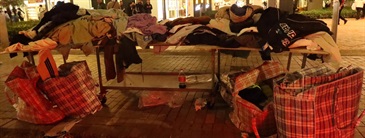 Hong Kong Customs on December 16 conducted a special operation in Kai Tak and Kwai Chung, and cracked down on one mobile hawker stall and its storage place. A total of about 1 300 items of suspected counterfeit apparel with an estimated market value of about $340,000 were seized. Photo shows the mobile hawker stall concerned in Kai Tak.