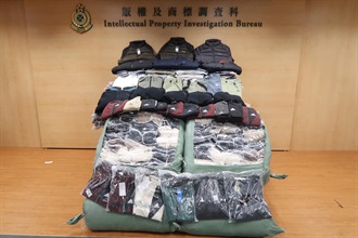 Hong Kong Customs on December 16 conducted a special operation in Kai Tak and Kwai Chung, and cracked down on one mobile hawker stall and its storage place. A total of about 1 300 items of suspected counterfeit apparel with an estimated market value of about $340,000 were seized. Photo shows the suspected counterfeit apparel seized.