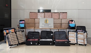 Hong Kong Customs mounted enforcement operations to combat illicit cigarette smuggling activities involving air passengers and shut down related illicit cigarette storage centres between September and December, successfully neutralising a transnational syndicate that smuggled illicit cigarettes through air passengers. Photo shows some of the illicit cigarettes seized.