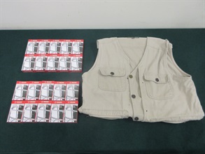 An 83-year-old incoming male passenger was sentenced to eight weeks' imprisonment by the Fanling Magistrates' Courts today (December 29) for possessing duty-not-paid cigarettes and failing to declare them to Customs officers, in contravention of the Dutiable Commodities Ordinance. Photo shows the duty-not-paid cigarettes and a vest seized.