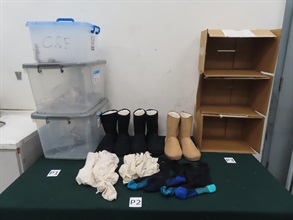 Hong Kong Customs seized 13 suspected scheduled endangered live lizards with an estimated market value of about $92,000 at Hong Kong International Airport on December 27. Photo shows the boots, socks and cloths used to conceal the batch of suspected scheduled endangered live lizards.