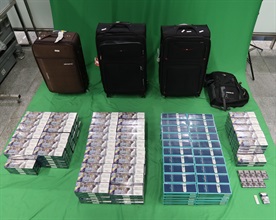 One incoming 27-year-old male passenger was sentenced to six months’ imprisonment and fined $1,000 by the West Kowloon Magistrates' Courts today (December 30) for importing duty-not-paid cigarettes and failing to declare them to Customs officers, in contravention of the Dutiable Commodities Ordinance. Photo shows the duty-not-paid cigarettes seized.