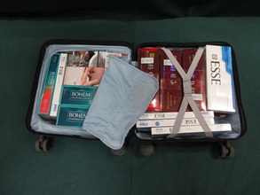 An incoming female passenger was sentenced to three months' imprisonment and fined $1,500 at the Fanling Magistrates' Courts today (January 15) for possessing duty-not-paid cigarettes and failing to declare them to Customs officers, in contravention of the Dutiable Commodities Ordinance. Photo shows the duty-not-paid cigarettes seized.