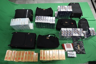 An incoming female passenger was sentenced to eight months' imprisonment and fined $600 by the West Kowloon Magistrates' Courts today (February 6) for importing duty-not-paid cigarettes and failing to declare them to Customs officers, in contravention of the Dutiable Commodities Ordinance. Photo shows the duty-not-paid cigarettes seized from the personal baggage of the 34-year-old female passenger.
