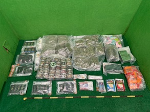 Hong Kong Customs detected a dangerous drugs case in Tsuen Wan yesterday (February 6) and seized about 5 kilograms of suspected cannabis buds, about 2 kg of suspected cannabis resin, a batch of suspected cannabis-containing gummy candies, chocolate, cannabis oil products, as well as 32 grams of suspected methamphetamine, and a batch of suspected drug packaging paraphernalia. The total estimated market value of the drug seizures was about $1.2 million. Photo shows the suspected dangerous drugs seized in the case.