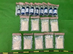 Hong Kong Customs seized about 1.8 kilograms of suspected ketamine and about 2.3 kilograms of suspected cannabis buds with a total estimated market value of about $1.6 million at Hong Kong International Airport on February 5 and 10 respectively. Two teenagers suspected to be involved in the cases were subsequently arrested yesterday (February 16). Photo shows the suspected ketamine seized and the nine health supplement bottles used to conceal the dangerous drugs.