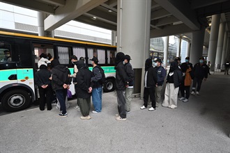 Ten incoming passengers were sentenced to three to six months' imprisonment by the West Kowloon Magistrates' Courts yesterday and today (March 12 and 13) for importing and possessing duty-not-paid cigarettes, in contravention of the Dutiable Commodities Ordinance. Photo shows the 10 incoming air passengers arrested by Customs for importing and possessing duty-not-paid cigarettes at the airport on March 11.