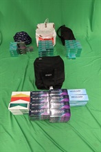 An incoming female passenger was sentenced to a total of five months' imprisonment by the Kowloon City Magistrates' Courts today (March 14) for dealing with duty-not-paid cigarettes, failing to declare them to Customs officers, as well as importing alternative smoking products, in contravention of the Dutiable Commodities Ordinance and the Import and Export Ordinance. Photo shows the duty-not-paid cigarettes and the alternative smoking products seized.