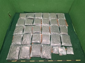 Hong Kong Customs yesterday (March 18) detected two passenger drug trafficking cases at Hong Kong International Airport and seized about 29 kilograms of suspected cannabis buds with a total estimated market value of about $6 million. Two men were arrested. Photo shows one batch of the suspected cannabis buds seized.