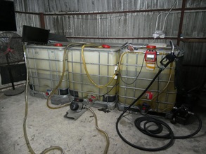 Hong Kong Customs, the Fire Services Department and the Hong Kong Police Force mounted an anti-illicit fuel joint operation yesterday (March 19). Photo shows the motor spirit containers seized in an illegal fuelling station shut down in Yuen Long.