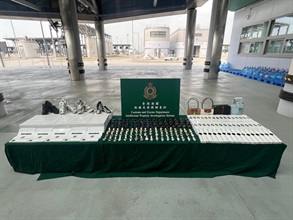 Hong Kong Customs on March 10 seized about 1 600 suspected counterfeit goods with an estimated market value of about $1.7 million at the Hong Kong-Zhuhai-Macao Bridge Hong Kong Port. Photo shows the suspected counterfeit goods seized.