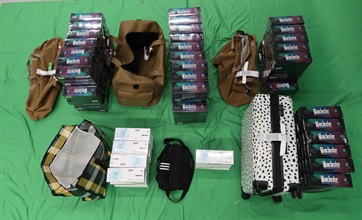 Three incoming passengers were sentenced by the courts today (March 23) to 12 weeks' imprisonment and fined $1,800; two months' imprisonment and fined $1,500; and six months' imprisonment and fined $1,000 respectively for possessing duty-not-paid cigarettes and failing to declare them to Customs officers, in contravention of the Dutiable Commodities Ordinance. Photo shows duty-not-paid cigarettes seized from the personal baggage of a 43-year-old incoming male passenger.