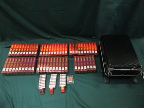 Four incoming passengers were sentenced to three months' imprisonment and a fine of $4,000, two months' imprisonment with a fine of $2,000 and two months’ imprisonment with a fine of $5,000 respectively by the Fanling Magistrates' Courts today (March 30) for possessing or importing duty-not-paid cigarettes and failing to declare them to Customs officers, in contravention of Dutiable Commodities Ordinance. Photo shows the duty-not-paid cigarettes seized from the personal baggage of a 37-year-old incoming female passenger.