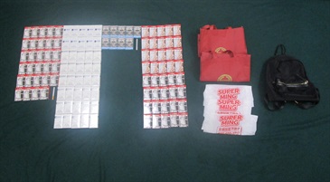Four incoming passengers were sentenced to three months' imprisonment and a fine of $4,000, two months' imprisonment with a fine of $2,000 and two months’ imprisonment with a fine of $5,000 respectively by the Fanling Magistrates' Courts today (March 30) for possessing or importing duty-not-paid cigarettes and failing to declare them to Customs officers, in contravention of Dutiable Commodities Ordinance. Photo shows the duty-not-paid cigarettes seized from the personal baggage of a 48-year-old incoming male passenger and an accompanying 53-year-old incoming female passenger.