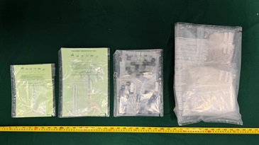Hong Kong Customs detected two dangerous drugs cases yesterday (April 14), and seized a total of about 3.4 kilograms of suspected ketamine, 950 grams of suspected methamphetamine, 52g of suspected crack cocaine and 38 suspected etomidate capsules, with an estimated market value of about $1.9 million. Two persons suspected to be connected with the cases were arrested. Photo shows the suspected methamphetamine, suspected crack cocaine and suspected etomidate capsules seized in the second case.