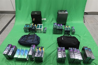 Eight incoming passengers were sentenced between eight to twelve months' imprisonment and fined $2,000 by the West Kowloon Magistrates' Courts today (April 18) for importing and dealing with duty-not-paid cigarettes and failing to declare them to Customs officers, in contravention of the Dutiable Commodities Ordinance (DCO). Photo shows the duty-not-paid cigarettes seized from the personal baggages of two of the eight incoming passengers.