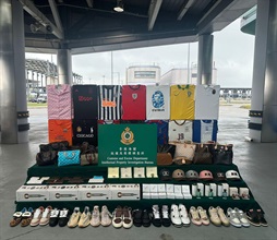 Hong Kong Customs on April 4 seized around 5 000 suspected counterfeit goods with a total estimated market value of around $1.4 million at the Hong Kong-Zhuhai-Macao Bridge Hong Kong Port. Photo shows the suspected counterfeit goods seized.