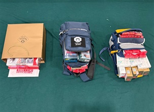 Two incoming passengers were sentenced to three months' imprisonment and six weeks' imprisonment with a fine of $1,000 respectively by the Fanling Magistrates' Courts today (April 21) for possessing duty-not-paid cigarettes and failing to declare them to Customs officers, in contravention of the Dutiable Commodities Ordinance. Photo shows the duty-not-paid cigarettes seized from the personal baggage of a 34-year-old incoming female passenger.
