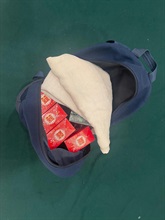 Two incoming passengers were sentenced to three months' imprisonment and six weeks' imprisonment with a fine of $1,000 respectively by the Fanling Magistrates' Courts today (April 21) for possessing duty-not-paid cigarettes and failing to declare them to Customs officers, in contravention of the Dutiable Commodities Ordinance. Photo shows the duty-not-paid cigarettes seized from the personal baggage of a 54-year-old incoming male passenger.