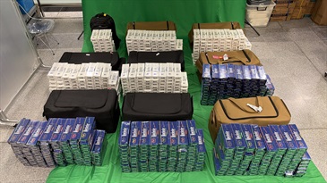 Three incoming passengers were sentenced to three to ten months' imprisonment and fined $1,000 each by the West Kowloon Magistrates' Courts today (April 23) for importing duty-not-paid cigarettes and failing to declare them to Customs officers, in contravention of the Dutiable Commodities Ordinance. Photo shows the duty-not-paid cigarettes seized in the first case.
