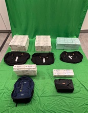 Three incoming passengers were sentenced to three to ten months' imprisonment and fined $1,000 each by the West Kowloon Magistrates' Courts today (April 23) for importing duty-not-paid cigarettes and failing to declare them to Customs officers, in contravention of the Dutiable Commodities Ordinance. Photo shows the duty-not-paid cigarettes seized in the second case.