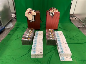 Three incoming passengers were sentenced to four weeks' to five months' imprisonment and fined $1,000 respectively by the Magistrates' Courts today (June 11) for possessing or importing duty-not-paid cigarettes and failing to declare them to Customs officers, in contravention of the Dutiable Commodities Ordinance. Photo shows the duty-not-paid cigarettes seized from the personal baggage of a 49-year-old incoming female passenger.