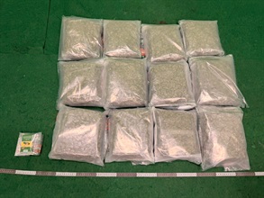 Hong Kong Customs detected a drug trafficking case involving two incoming air passengers at Hong Kong International Airport yesterday (May 1) and seized about 12 kilograms of suspected cannabis buds with an estimated market value of about $2.3 million, and nine suspected duty-not-paid cigarettes. Photo shows the suspected cannabis buds and duty-not-paid cigarettes seized.