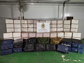 Hong Kong Customs has been mounting an enforcement operation codenamed "Clear Sky" since April 17, and detected illicit cigarette smuggling cases involving air passengers. Customs also raided a related illicit cigarette storage centre. Photo shows some of the suspected illicit cigarettes seized from a suspected illicit storage centre in a metal hut in Yuen Long.