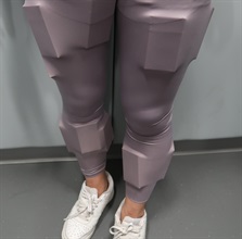 An incoming passenger was sentenced to four weeks' imprisonment with a fine of $2,000 by the Fanling Magistrates' Courts today (June 1) for possessing duty-not-paid cigarettes and failing to declare them to Customs officers, in contravention of the Dutiable Commodities Ordinance. Photo shows the 59-year-old incoming female passenger with the duty-not-paid cigarettes concealed around her thighs and calves.