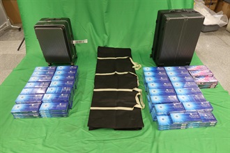 An incoming male passenger was sentenced to five months' imprisonment and fined $1,000 by the West Kowloon Magistrates' Courts today (June 8) for importing duty-not-paid cigarettes and failing to declare them to Customs officers, in contravention of the Dutiable Commodities Ordinance. Photo shows the duty-not-paid cigarettes seized.