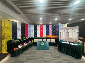 With the 2026 FIFA World Cup matches approaching, Hong Kong Customs conducted an enforcement operation codenamed "Clean Sheet" between May 26 and yesterday (June 10) with a view to combating counterfeit and infringing goods activities related to the World Cup involving cross-boundary transshipments and online sales. A total of 34 related cases were detected and about 230 000 items of suspected counterfeit goods, with a total estimated market value of about $156 million, were seized. Photo shows some of the suspected counterfeit goods seized.
