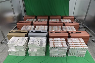 Two incoming male passengers were each sentenced to 10 months' imprisonment and fined $1,000 by the West Kowloon Magistrates' Courts today (June 12) for importing duty-not-paid cigarettes and failing to declare them to Customs officers, in contravention of the Dutiable Commodities Ordinance. Photo shows the duty-not-paid cigarettes seized.