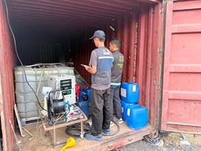 Hong Kong Customs and the Fire Services Department mounted a territory-wide operation targeting illicit fuel activities on June 10. During the operation, officers of the two departments detected two related cases and seized about 3 200 litres of illicit motor spirit, with an estimated market value of about $104,000 and a duty potential of about $20,000. Two persons were arrested, and one vehicle connected with one of the cases was also seized. Photo shows an illegal fuelling station raided in Tung Chung.